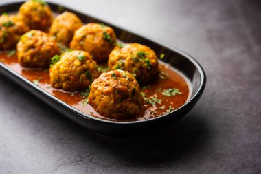 Veg Kofta Curry is an exotic Indian gravy dish made from mix vegetable dumplings dunked in a onion-tomato based gravy