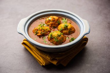 Veg Kofta Curry is an exotic Indian gravy dish made from mix vegetable dumplings dunked in a onion-tomato based gravy