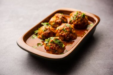 Veg Kofta Curry is an exotic Indian gravy dish made from mix vegetable dumplings dunked in a onion-tomato based gravy