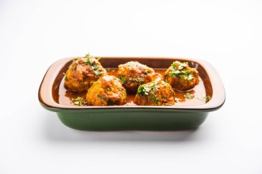 Veg Kofta Curry is an exotic Indian gravy dish made from mix vegetable dumplings dunked in a onion-tomato based gravy