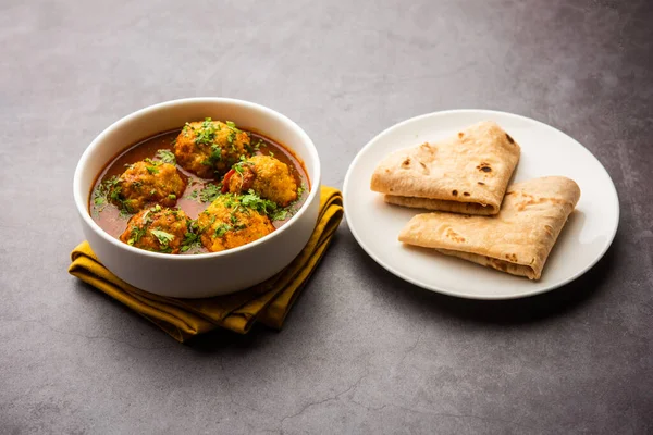 Veg Kofta Curry is an exotic Indian gravy dish made from mix vegetable dumplings dunked in a onion-tomato based gravy