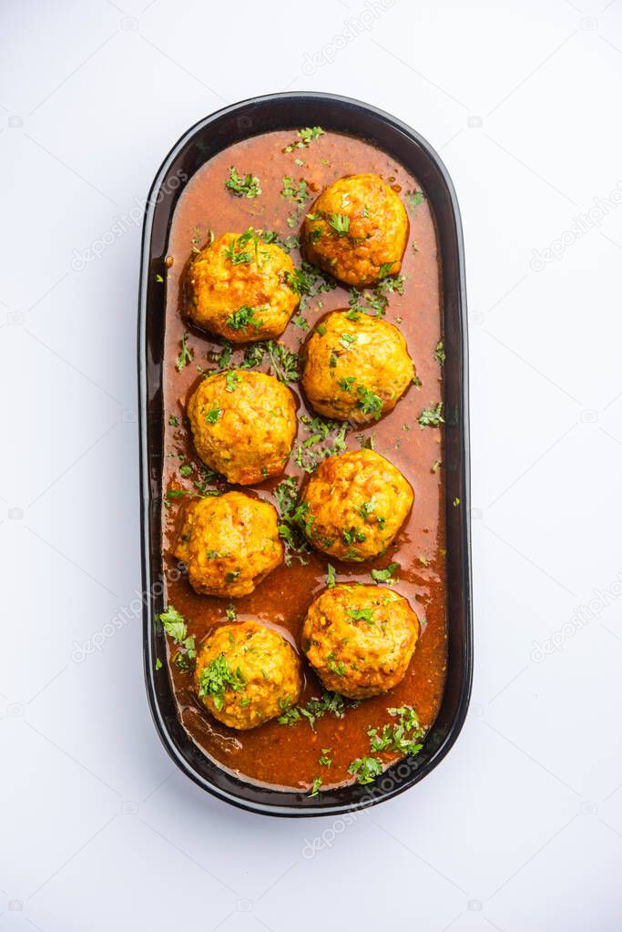 Veg Kofta Curry is an exotic Indian gravy dish made from mix vegetable dumplings dunked in a onion-tomato based gravy