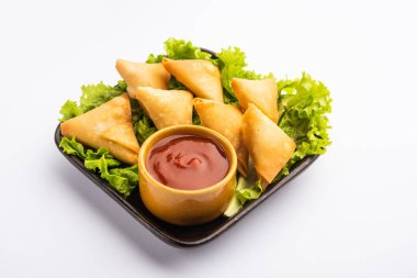 cocktail mini triangle samosa made using patti or strip, popular home made snack from India