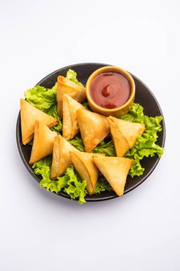 cocktail mini triangle samosa made using patti or strip, popular home made snack from India