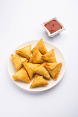 cocktail mini triangle samosa made using patti or strip, popular home made snack from India