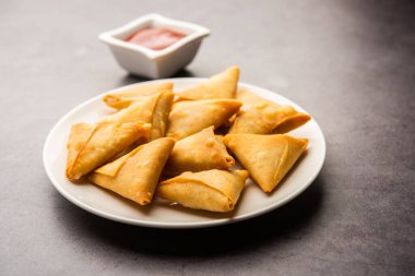cocktail mini triangle samosa made using patti or strip, popular home made snack from India