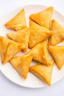 cocktail mini triangle samosa made using patti or strip, popular home made snack from India