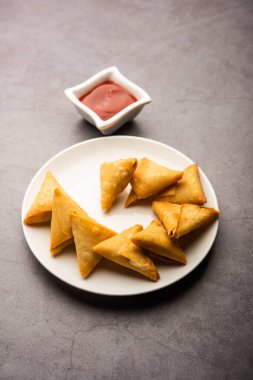 cocktail mini triangle samosa made using patti or strip, popular home made snack from India