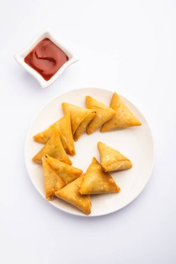 cocktail mini triangle samosa made using patti or strip, popular home made snack from India