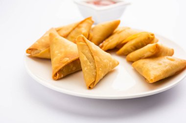 cocktail mini triangle samosa made using patti or strip, popular home made snack from India