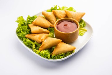 cocktail mini triangle samosa made using patti or strip, popular home made snack from India