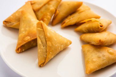 cocktail mini triangle samosa made using patti or strip, popular home made snack from India