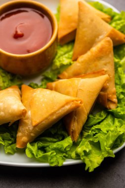cocktail mini triangle samosa made using patti or strip, popular home made snack from India