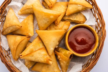 cocktail mini triangle samosa made using patti or strip, popular home made snack from India