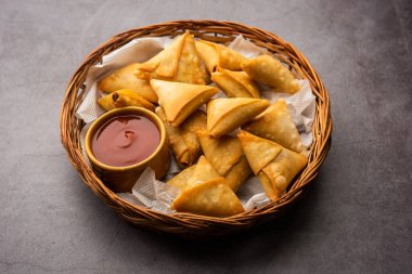 cocktail mini triangle samosa made using patti or strip, popular home made snack from India