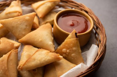 cocktail mini triangle samosa made using patti or strip, popular home made snack from India