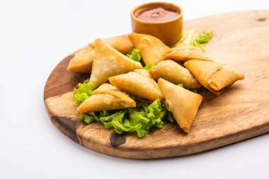 cocktail mini triangle samosa made using patti or strip, popular home made snack from India
