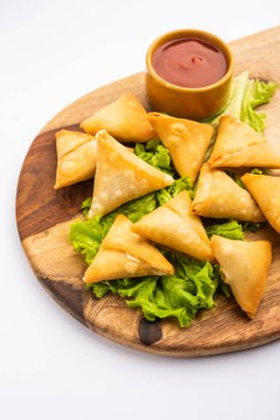 cocktail mini triangle samosa made using patti or strip, popular home made snack from India
