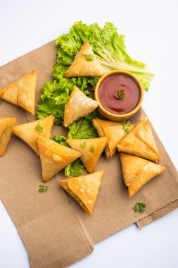 cocktail mini triangle samosa made using patti or strip, popular home made snack from India