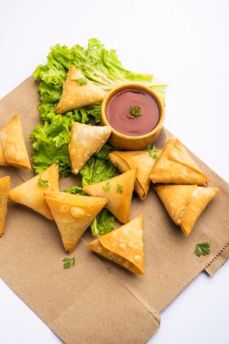 cocktail mini triangle samosa made using patti or strip, popular home made snack from India