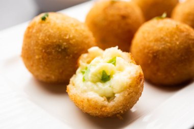 jalapeno cheese balls or poppers served with tomato ketchup