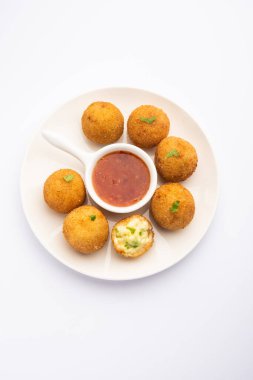 jalapeno cheese balls or poppers served with tomato ketchup