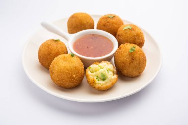 jalapeno cheese balls or poppers served with tomato ketchup