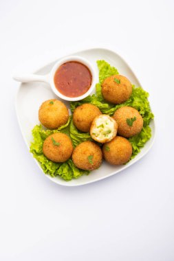 jalapeno cheese balls or poppers served with tomato ketchup