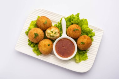 jalapeno cheese balls or poppers served with tomato ketchup