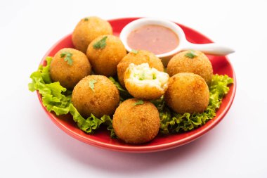 jalapeno cheese balls or poppers served with tomato ketchup
