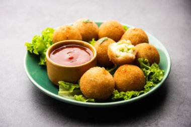 jalapeno cheese balls or poppers served with tomato ketchup