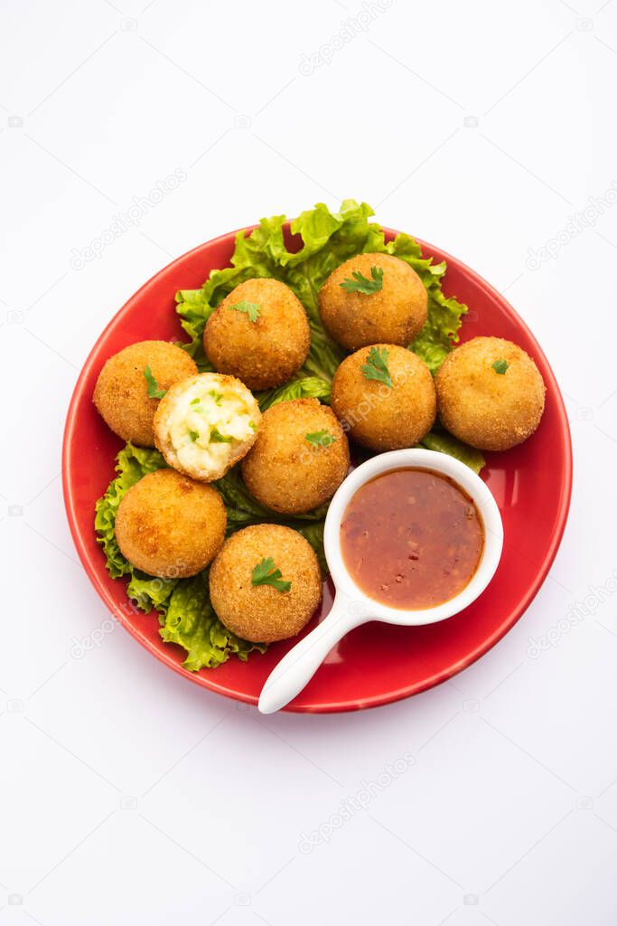 jalapeno cheese balls or poppers served with tomato ketchup