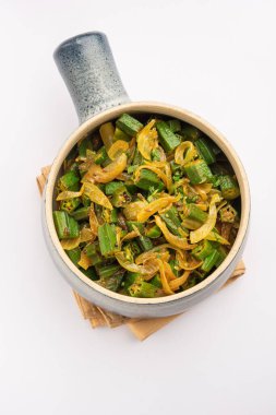 Bhindi do pyaza is a restaurant style North Indian dish made with okra or ladies finger orochro, spices, herbs & lots of onions