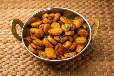 Stir fried taro roots. Arbi ki sabji, ghuiya masala curry Sabzi or arvi dum Masala. Garnished with coriander