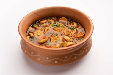 Stir fried taro roots. Arbi ki sabji, ghuiya masala curry Sabzi or arvi dum Masala. Garnished with coriander clipart