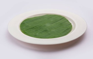 boş tabak muz yaprağı üzerinde yemek veya konu Düzenle