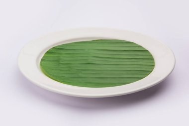 boş tabak muz yaprağı üzerinde yemek veya konu Düzenle