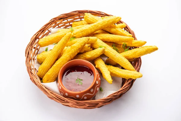 Crispy fried baby corn pakoda, pakora  or Baby corn fritters served with ketchup, Indian food