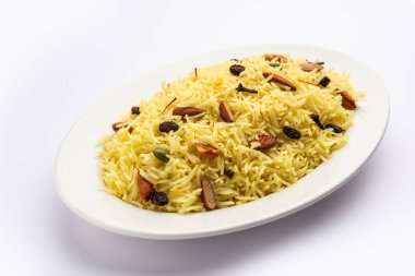 Kashmiri sweet modur pulao made of rice cooked with sugar, water flavored with Saffron and dry fruits