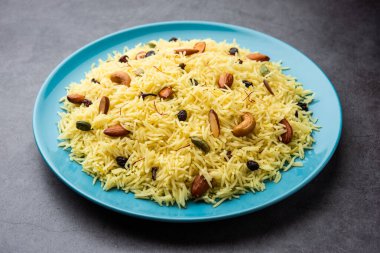 Kashmiri sweet modur pulao made of rice cooked with sugar, water flavored with Saffron and dry fruits clipart
