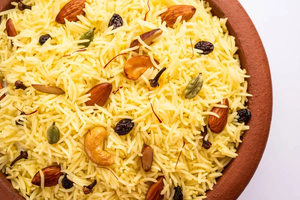 Kashmiri sweet modur pulao made of rice cooked with sugar, water flavored with Saffron and dry fruits