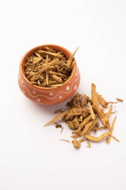Ayurvedic Daruharidra - Daru haldi or tree turmeric isolated over white background