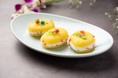 Malai Chop or Cream sandwich made using filling Rasgulla or Gulab jamun sweet is a Bengali sweet