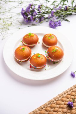 Malai Chop or Cream sandwich made using filling Rasgulla or Gulab jamun sweet is a Bengali sweet