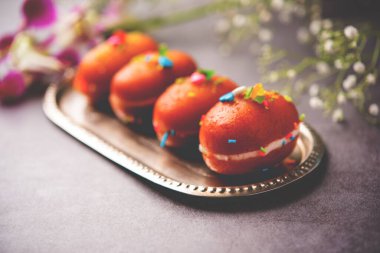 Malai Chop or Cream sandwich made using filling Rasgulla or Gulab jamun sweet is a Bengali sweet