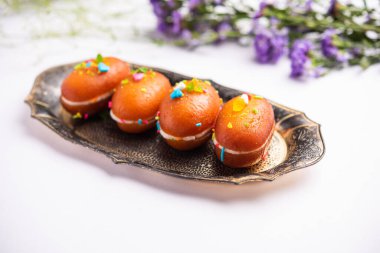 Malai Chop or Cream sandwich made using filling Rasgulla or Gulab jamun sweet is a Bengali sweet