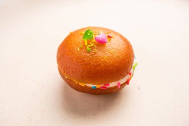 Malai Chop or Cream sandwich made using filling Rasgulla or Gulab jamun sweet is a Bengali sweet