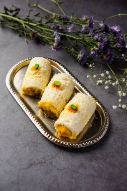 Malai Chop or Cream sandwich made using filling Rasgulla or Gulab jamun sweet is a Bengali sweet