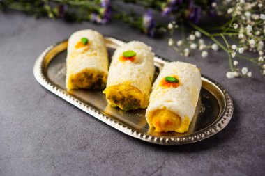 Malai Chop or Cream sandwich made using filling Rasgulla or Gulab jamun sweet is a Bengali sweet