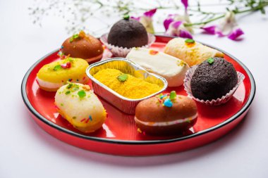 Malai Chop or Cream sandwich which is a bengali sweet, with kala jamun or black gulab jamun